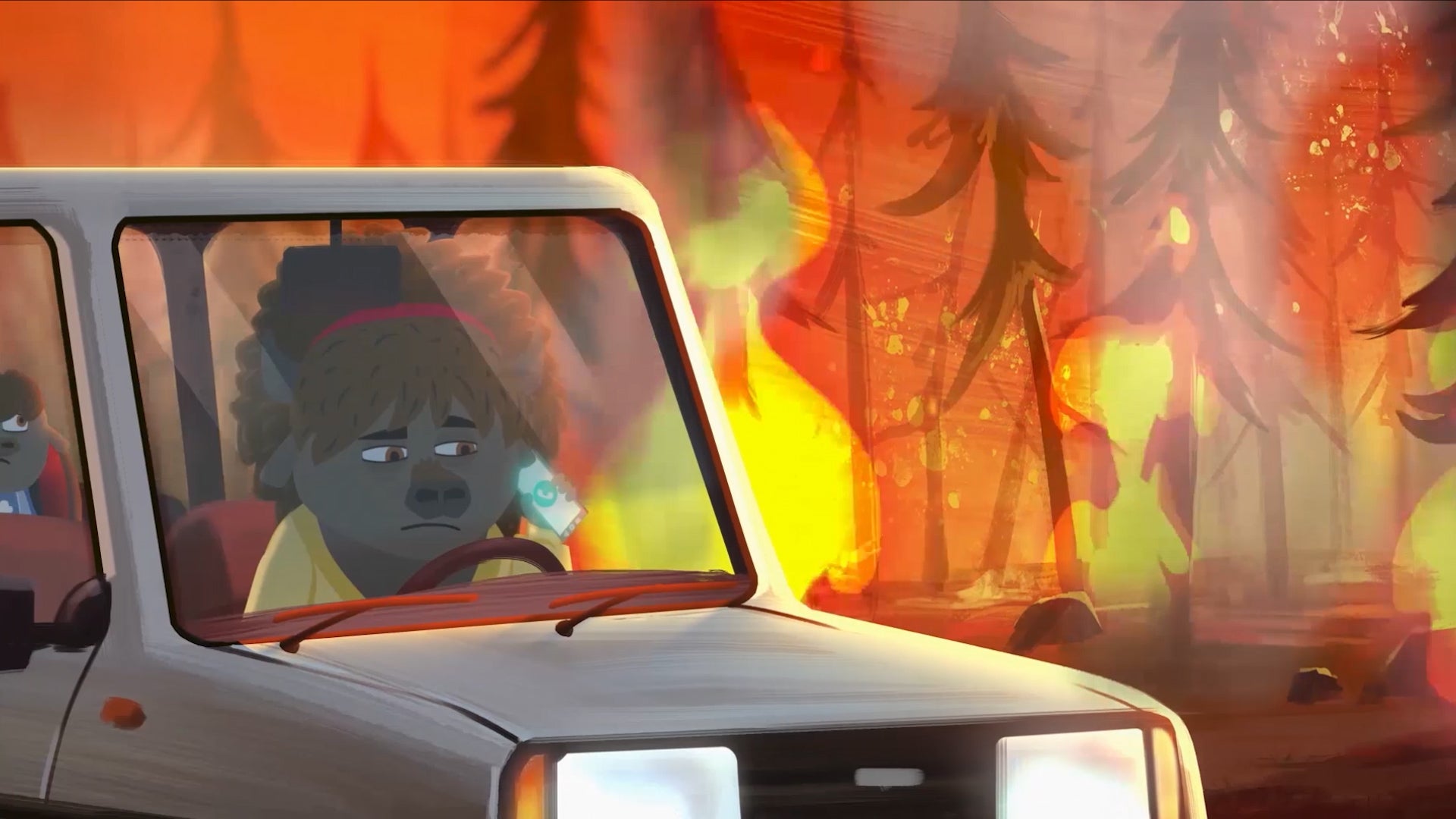 Buffalo shown in a car driving through a forest fire. 