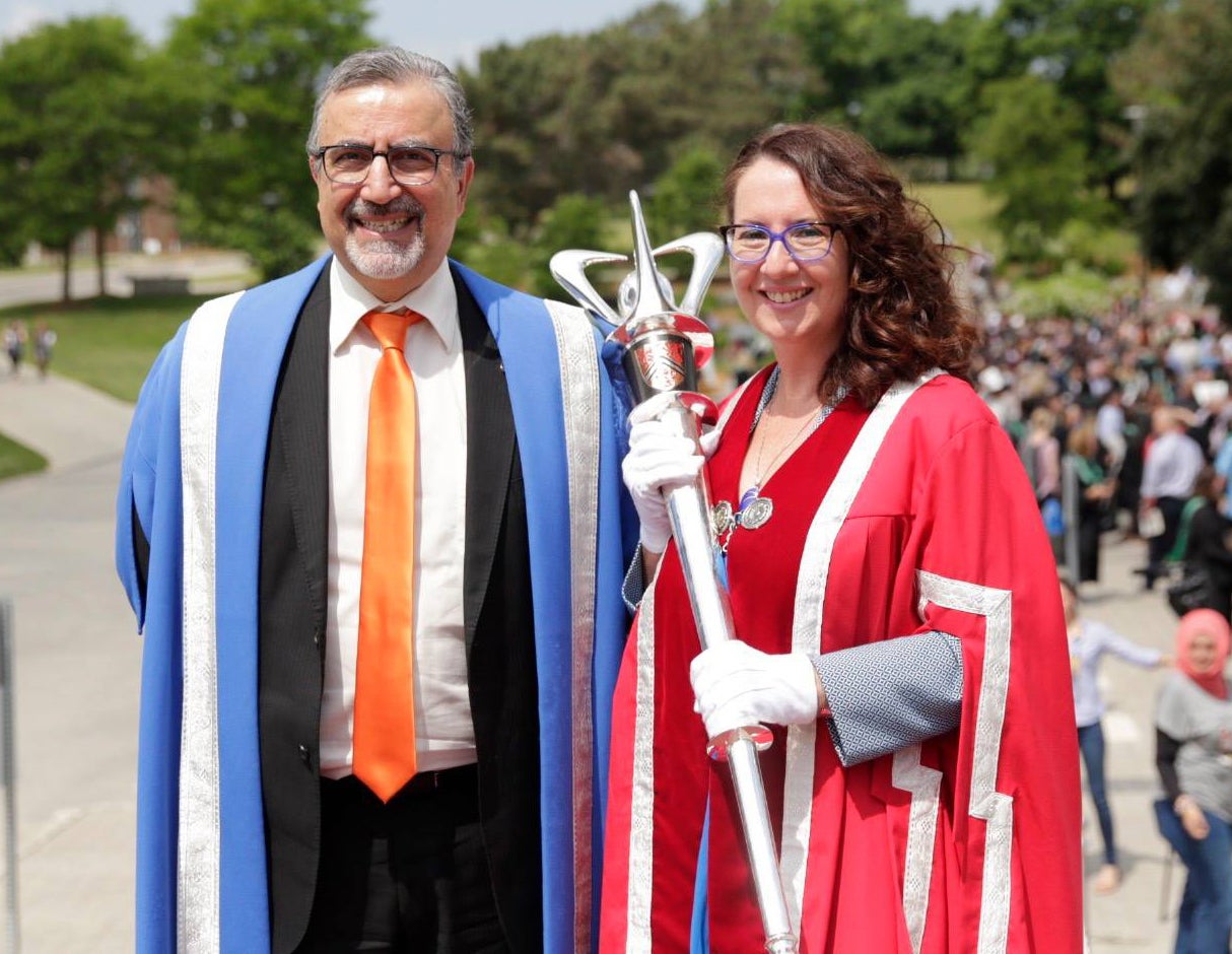 Waterloo President Feridun Hamdullahpur and Renison President Wendy Fletcher, who is holding the university's mace
