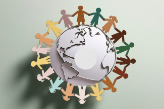 Paper cutout people holding hands around globe