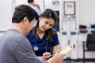 Senior patient signing medical consent form