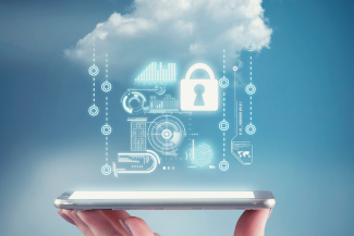 Hand holding a phone with a cloud and personal data information. The concept of personal data security