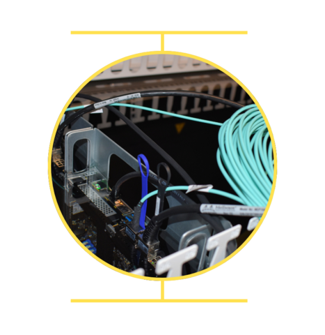 Teal, blue and black cables as part of a larger computer system