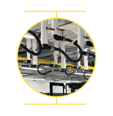 White water pipes hanging from the ceiling