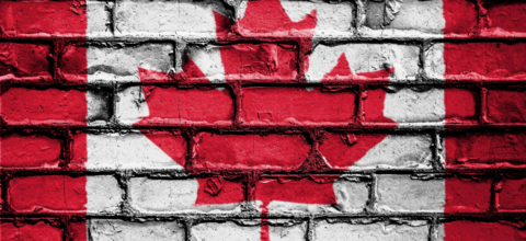 Canada flag painted on a brick wall