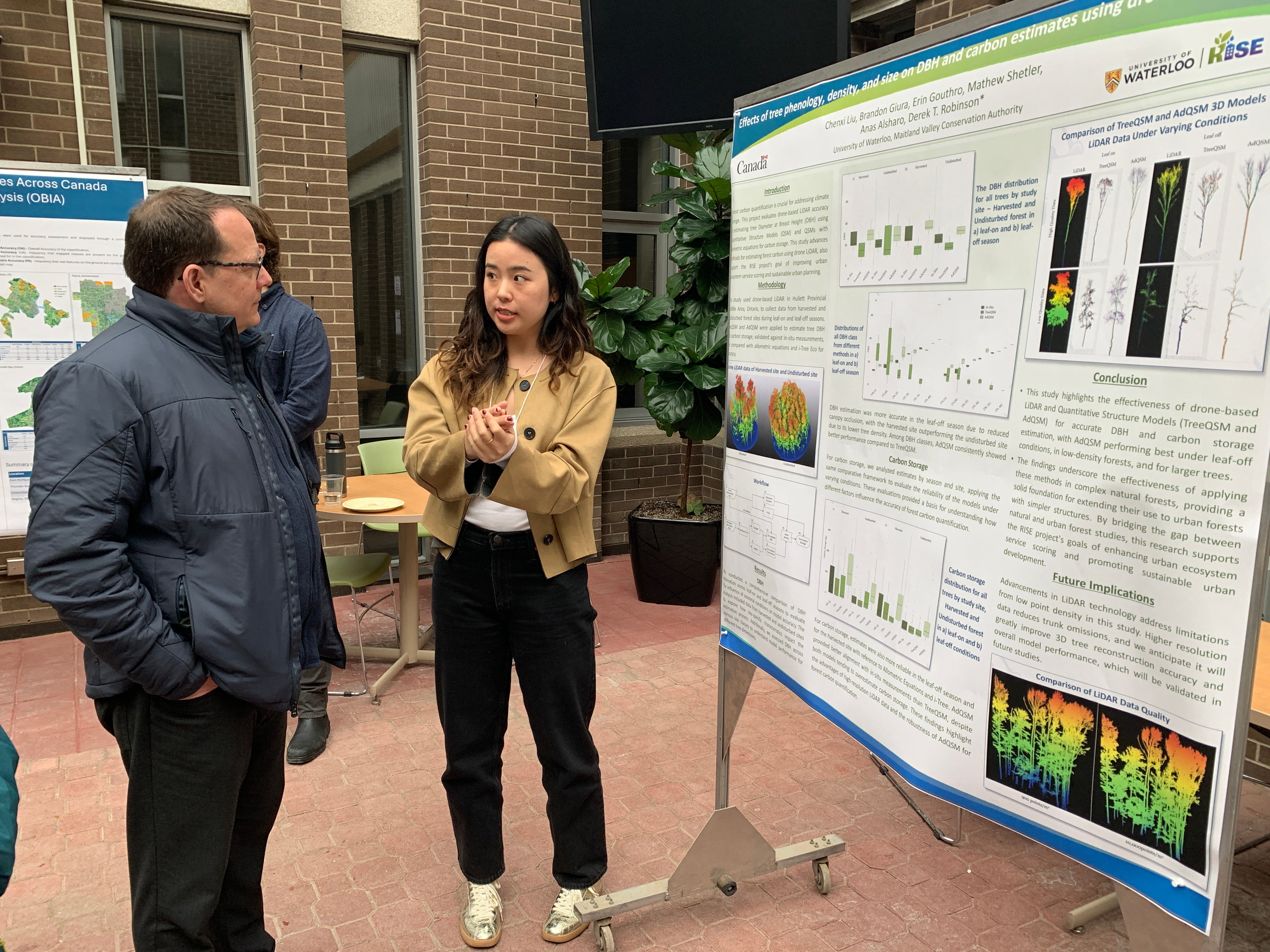 MPP Mike Schreiner talking with RISE student Chenxi Liu.
