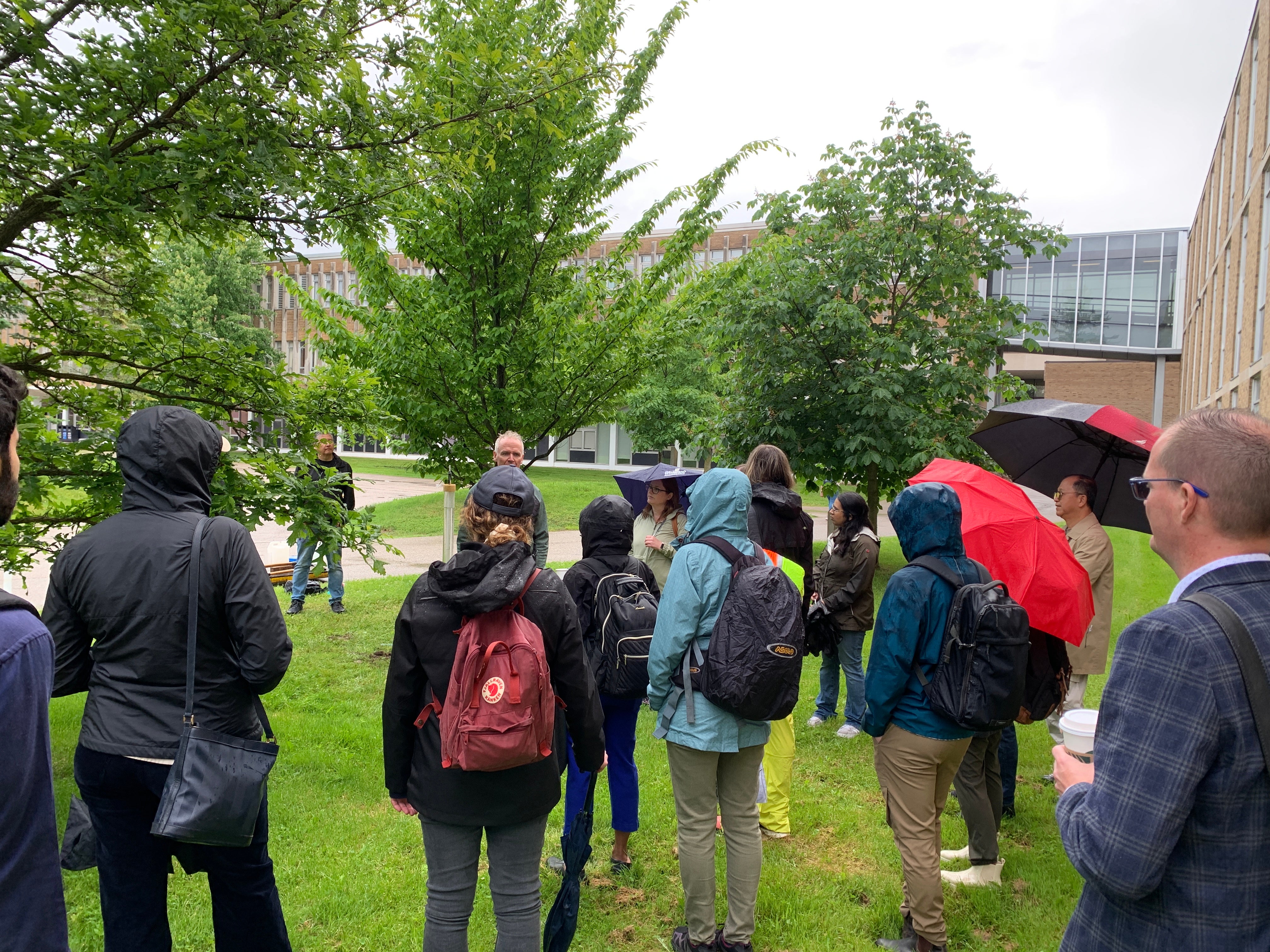 Participants observing the stormwater hydrology demonstration on campus.