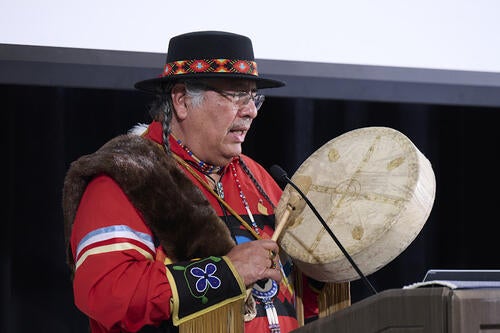 Elder Henry drumming.