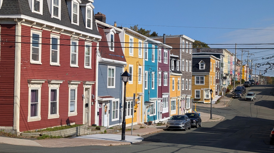 Brightly painted homes on the street in Newfoundland.