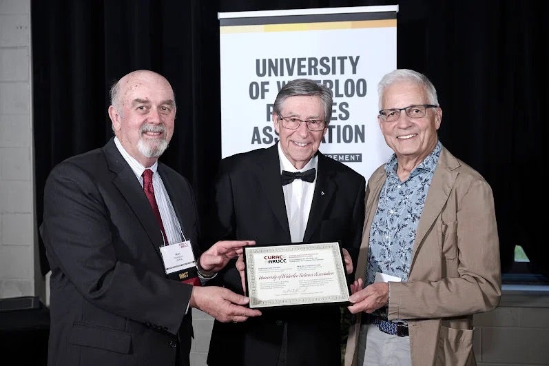 Ron and Jim receive the CURAC Award.