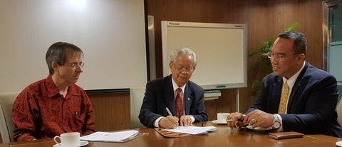 Image of Prof. Dr. (Hon) Jonathan L. Parapak, Prof. Dr. Manlian Ronald A. Simanjuntak, and William James Duggan
