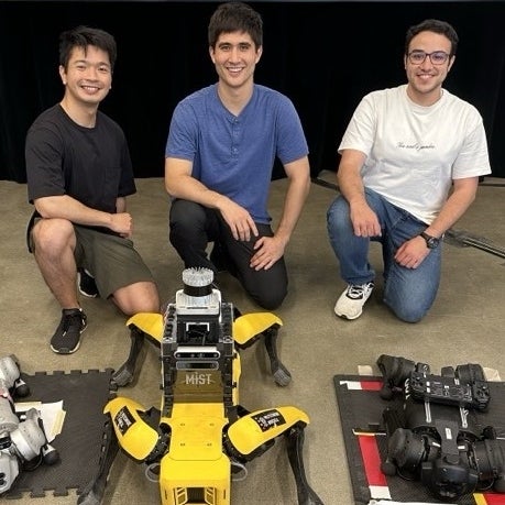 Picture of AIR Lab grad students Jeffrey Lee, Geoffrey Hanks, and Hisham Khalil with Quadrupeds