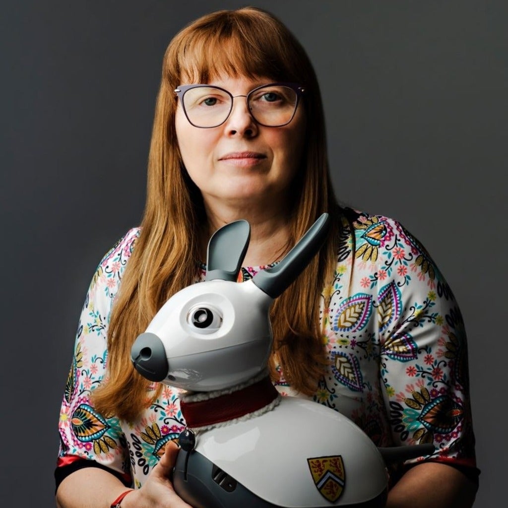 Kerstin Dautenhahn holding a robot