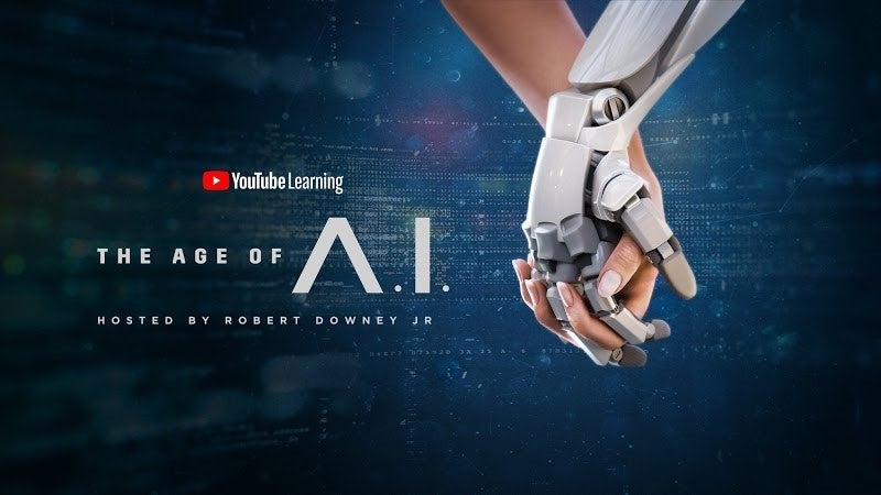 The Age of A.I. Banner with a human and robot holding hands