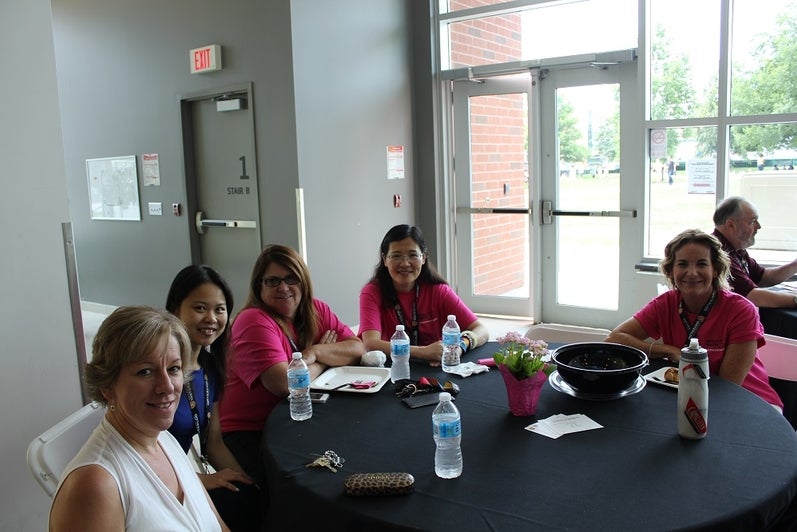 group smiling at a table