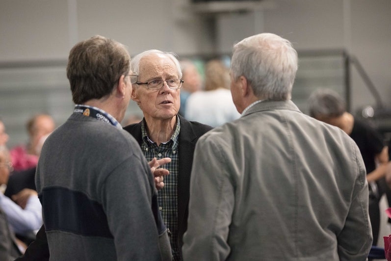 group of men conversing