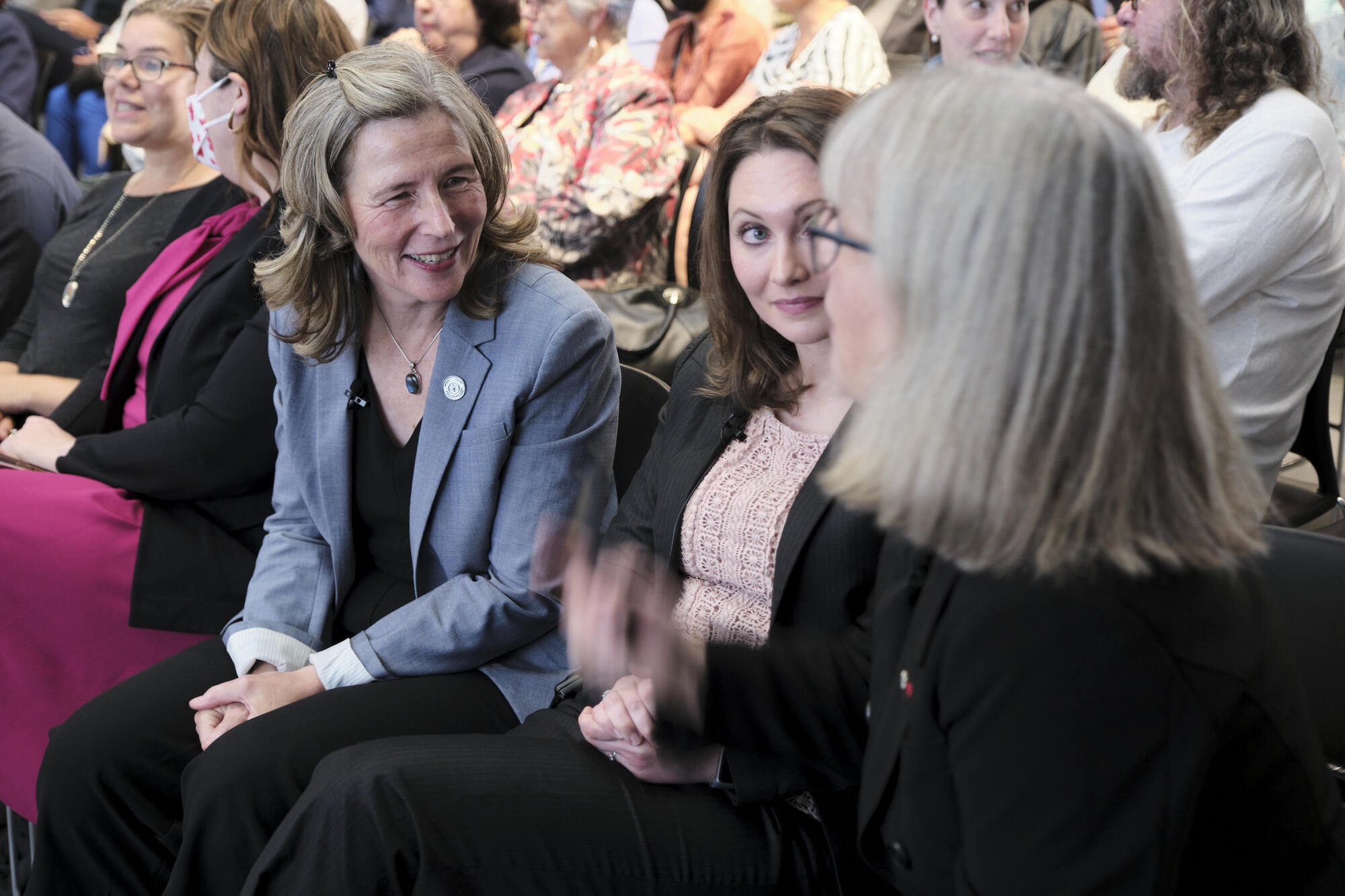 Dean Mary Wells, CRC Ashley Rose Mehlenbacher, and Nobel Laureate Donna Strickland in conversation in the audience of TRuST's inaugural event.