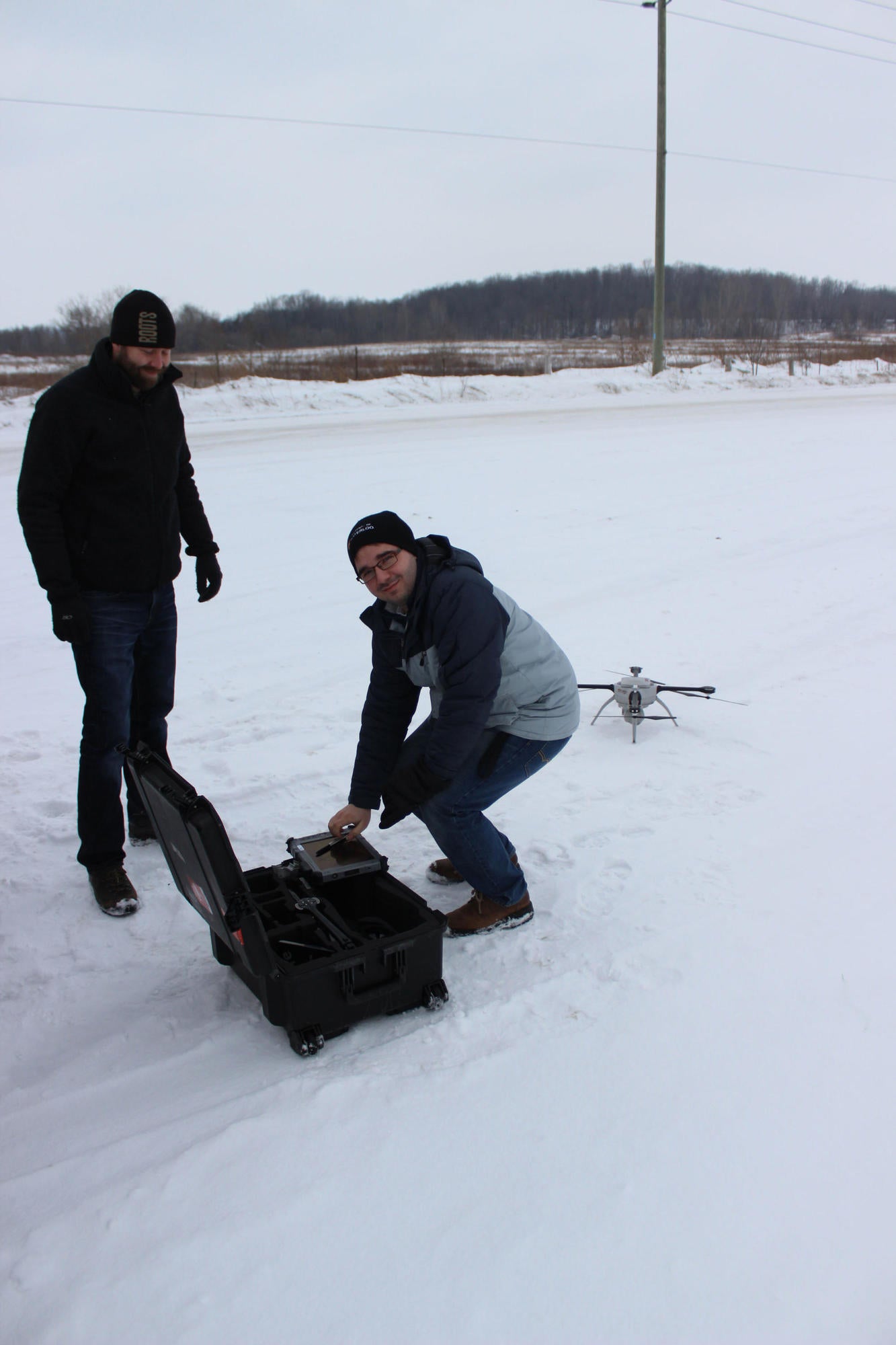 Derek Robinson and Andrei Balulescu unboxing the UAV