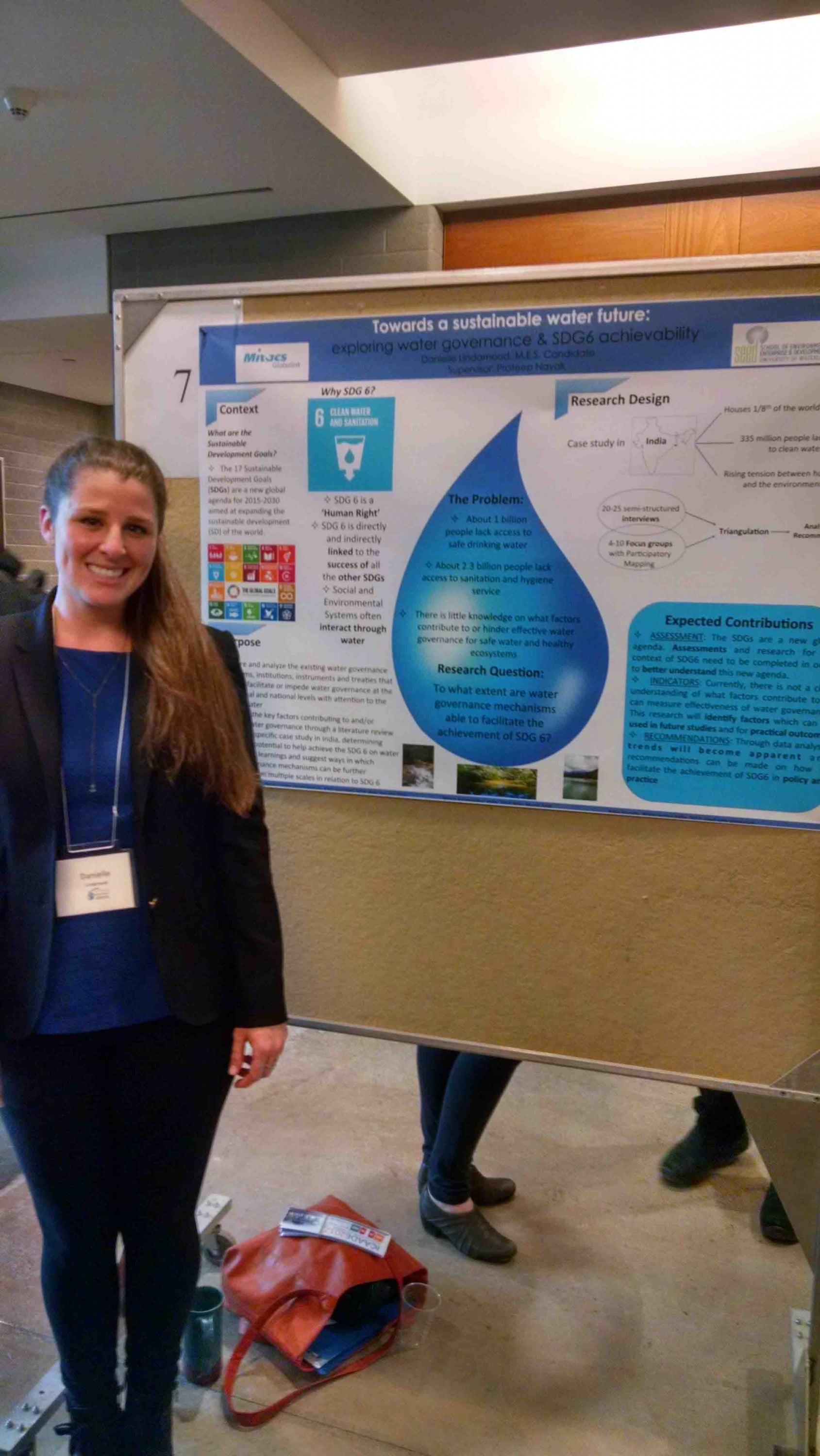 Danielle at a conference presenting her poster
