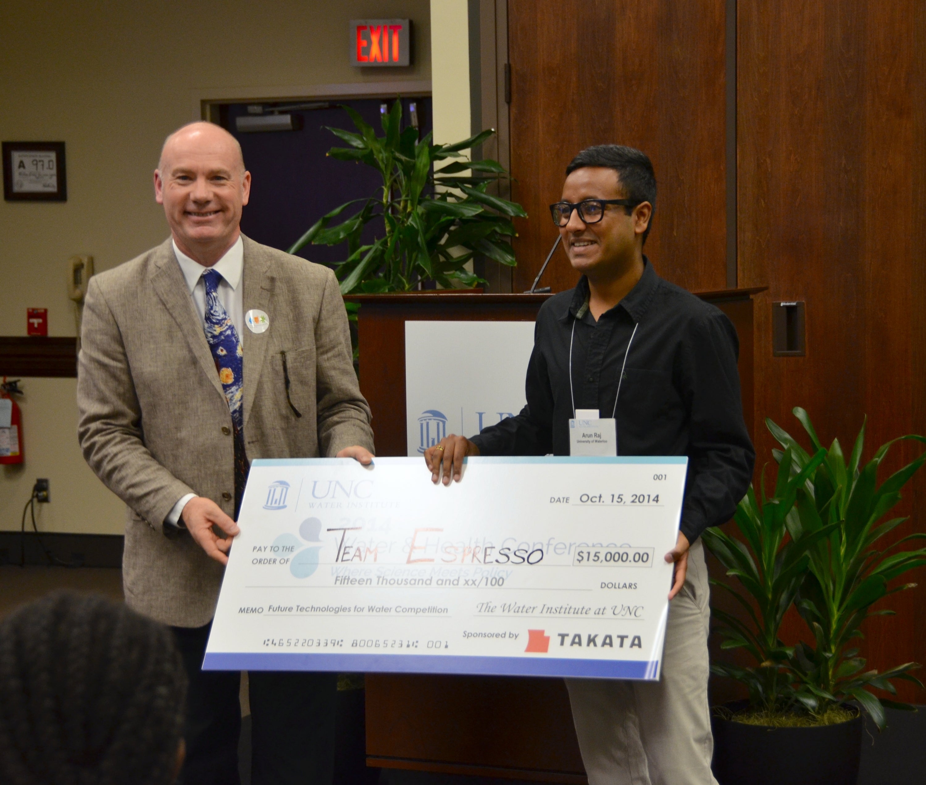 Arun Raj recieving $15,000 cheque as first place winner in competition