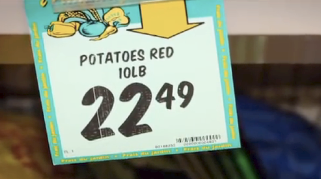 grocery store sign displaying 10lb bag of potatoes for sale at $22.49 CA