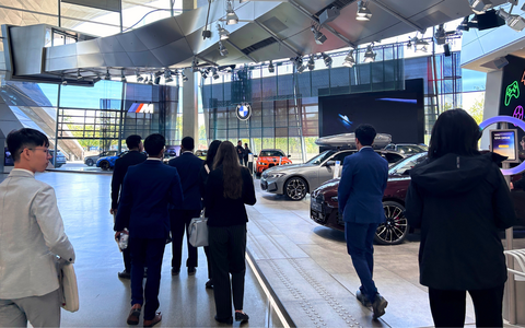 Students walking though BMW Welt