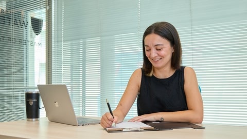 Graduate student working on a laptop