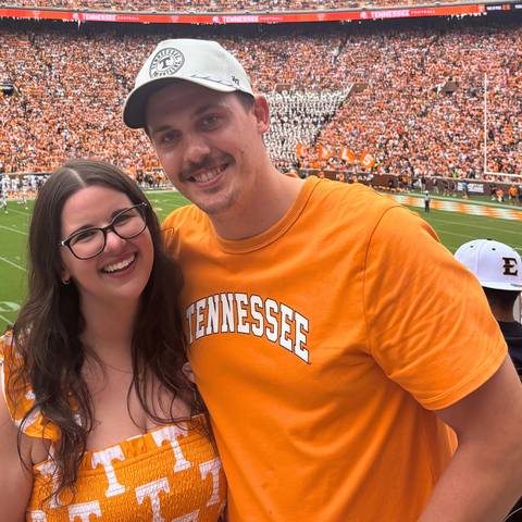 Jillian Adams and her husband, Andrew Ellis, at a University of Tennessee football game