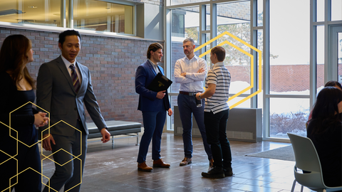 Students and professors discussing in Hagey Hall
