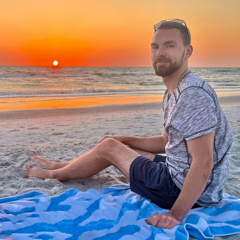 Benjamin Loewen on a beach at sunset