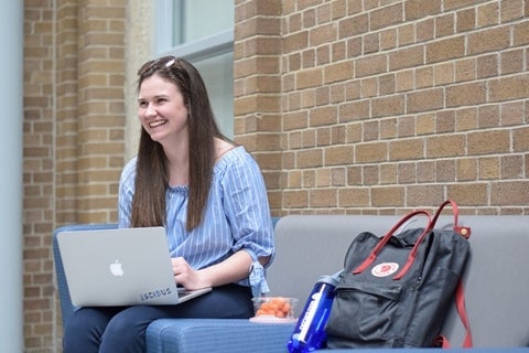 Student sitting with laptop