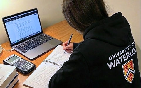 A female student studying at her desk