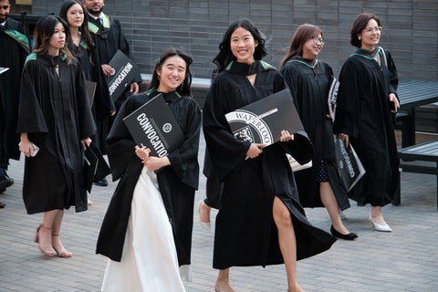 Natasha Chen amongst a crowd of SAF students at Convocation