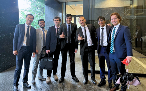 SAF students pose for a photo in wet business attire