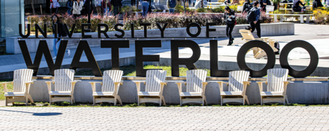 Image of the University of Waterloo sign with chairs in front of the sign directing to the CPA CFE Honor Roll page