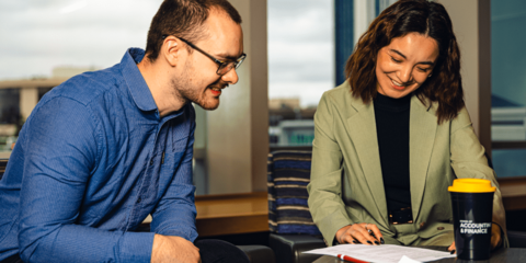 Student reviewing document with an employer