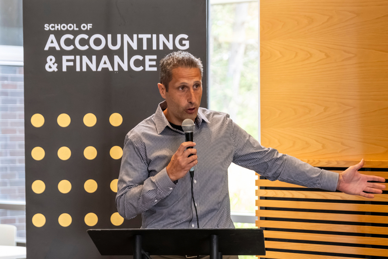 Andrew Bauer speaking at the ceremony