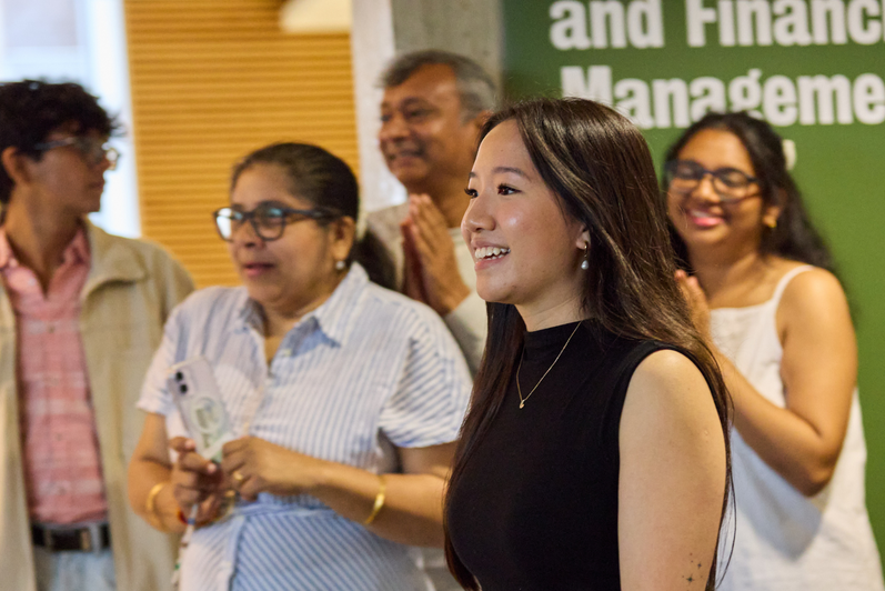 SFM graduates watch a presentation at the special reception.