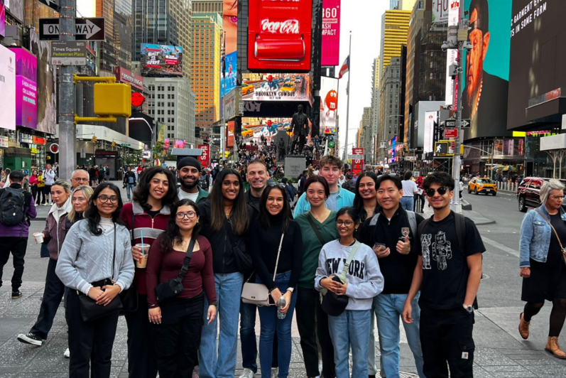Students pose at Times Square
