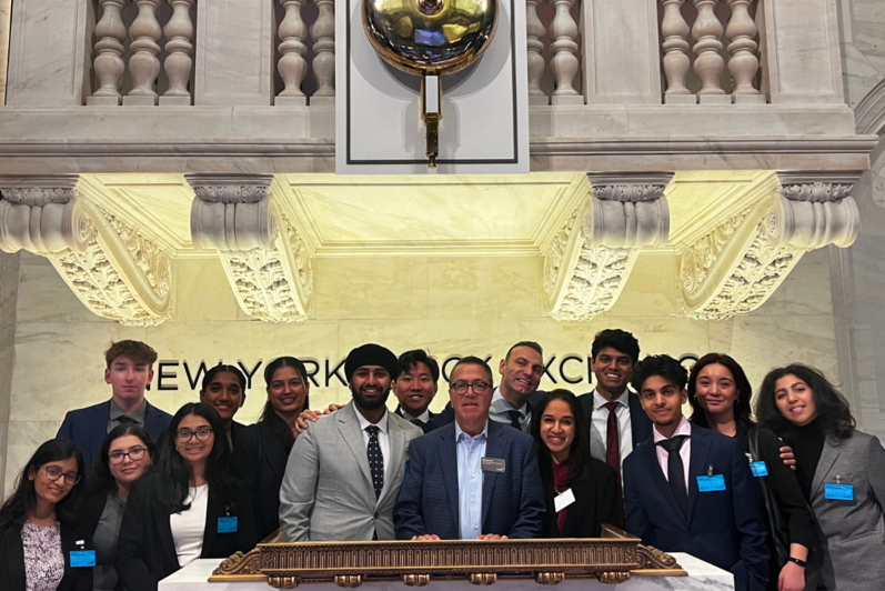 Students pose at of New York Stock Exchange
