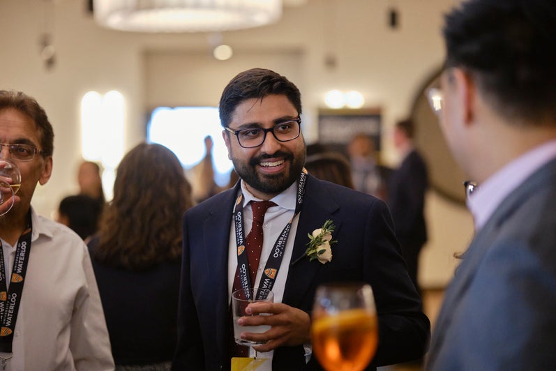 Adnan Khan mingling with guests at the alumni excellence gala