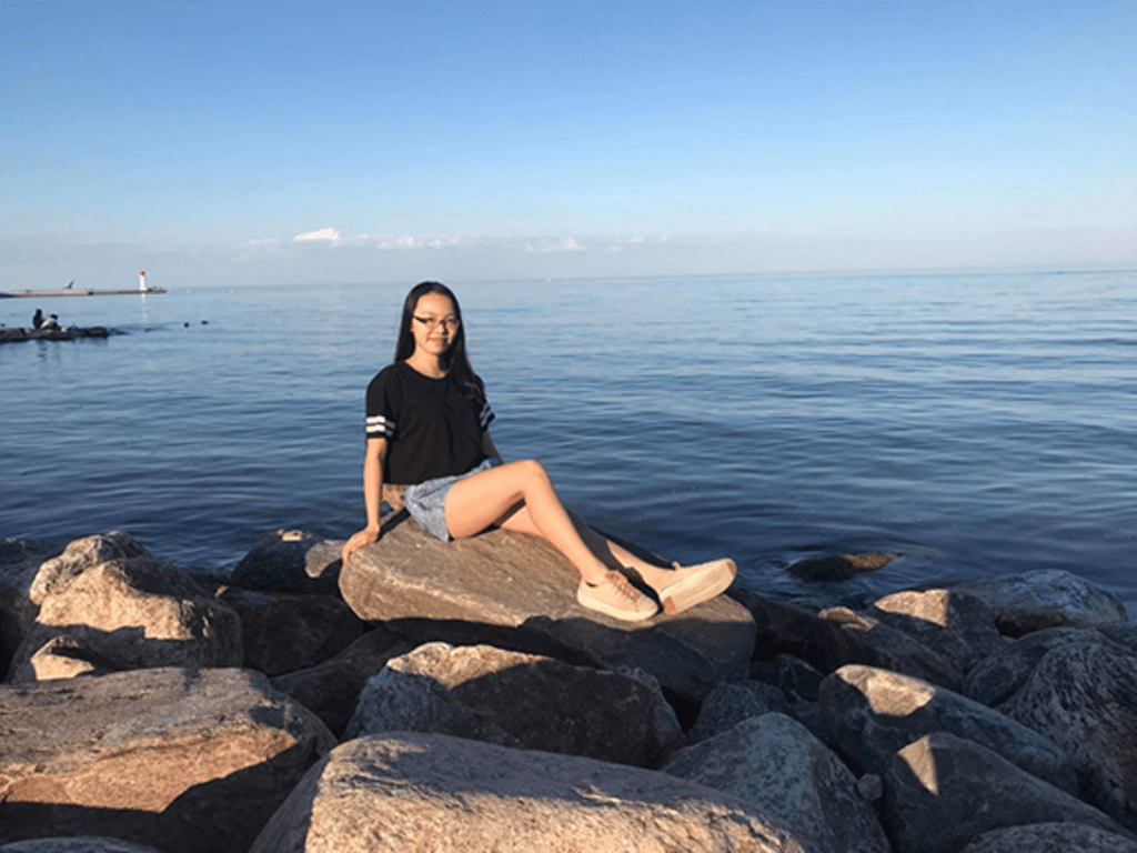 woman sitting on a rock