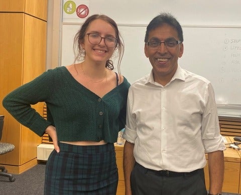 an image of Alex, with her SBC professor 