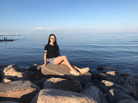woman sitting on a rock