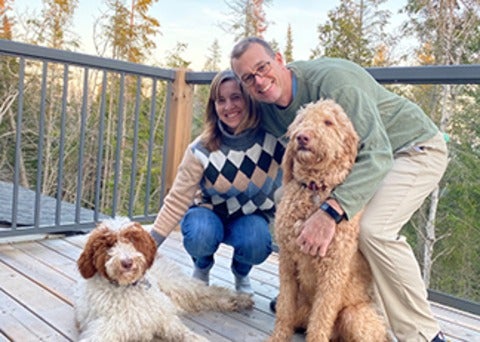 Tracy Hilpert and partner with dogs