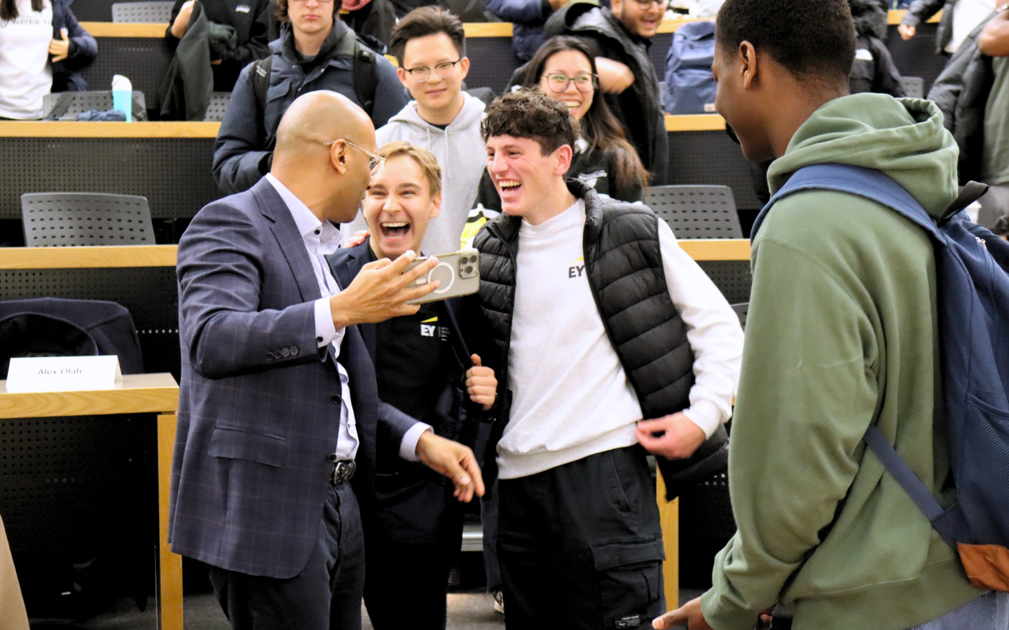 Benjie Thomas taking a selfie with students