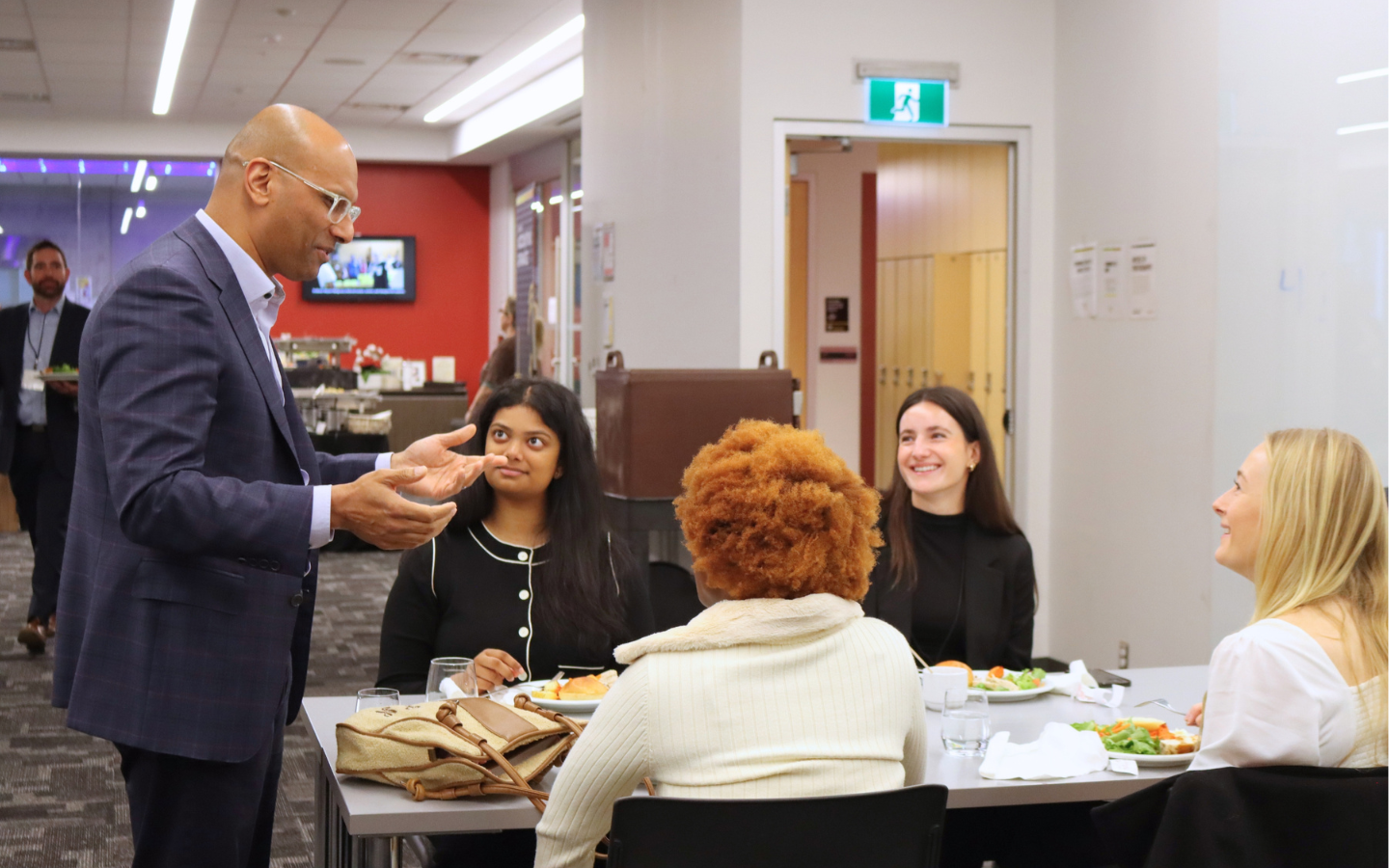 Benjie Thomas speaking with student recipients of scholarship