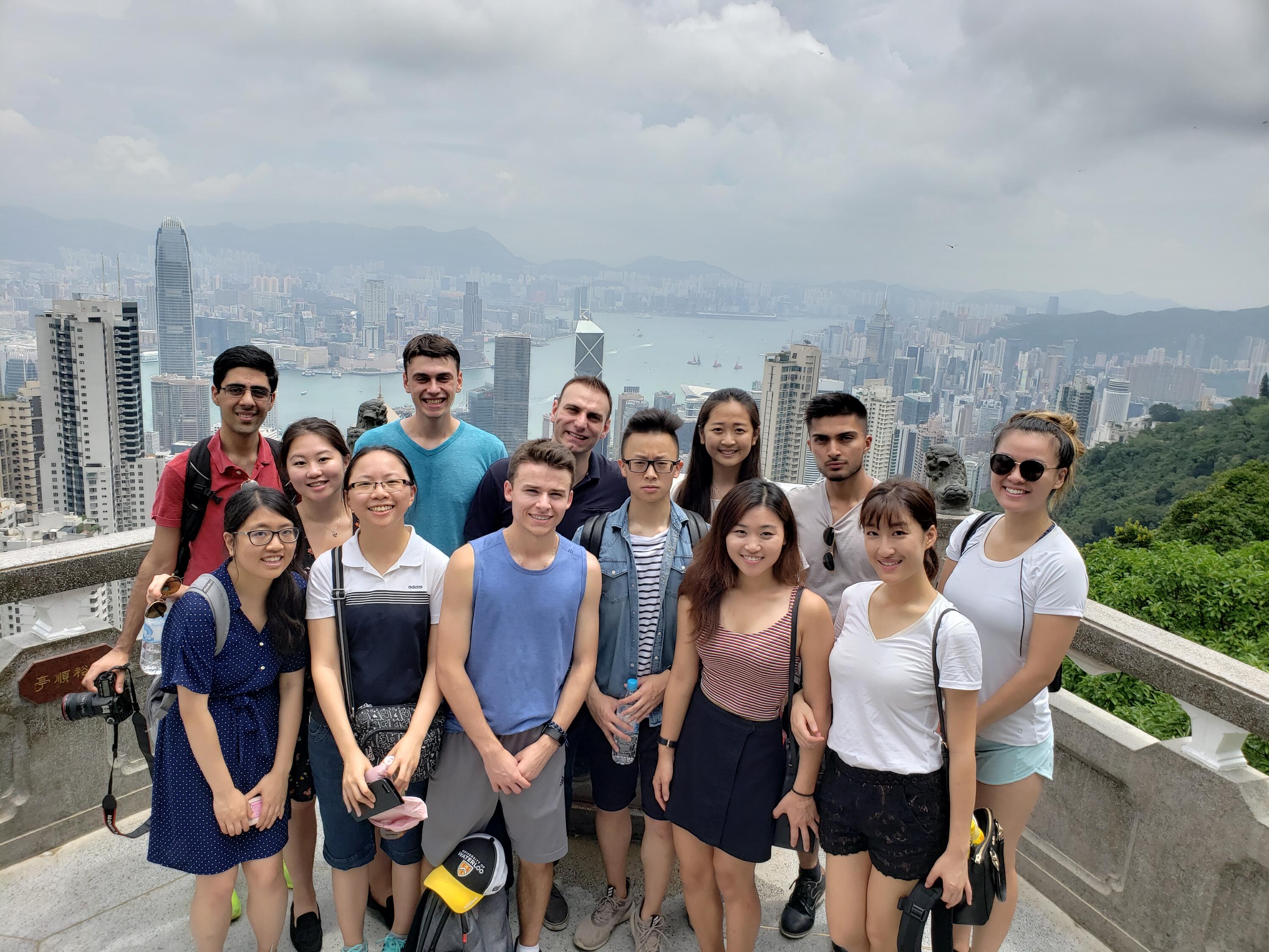 Students in front of the Hong Kong skyline