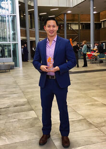 David Ha holding Faculty Excellence in Teaching award