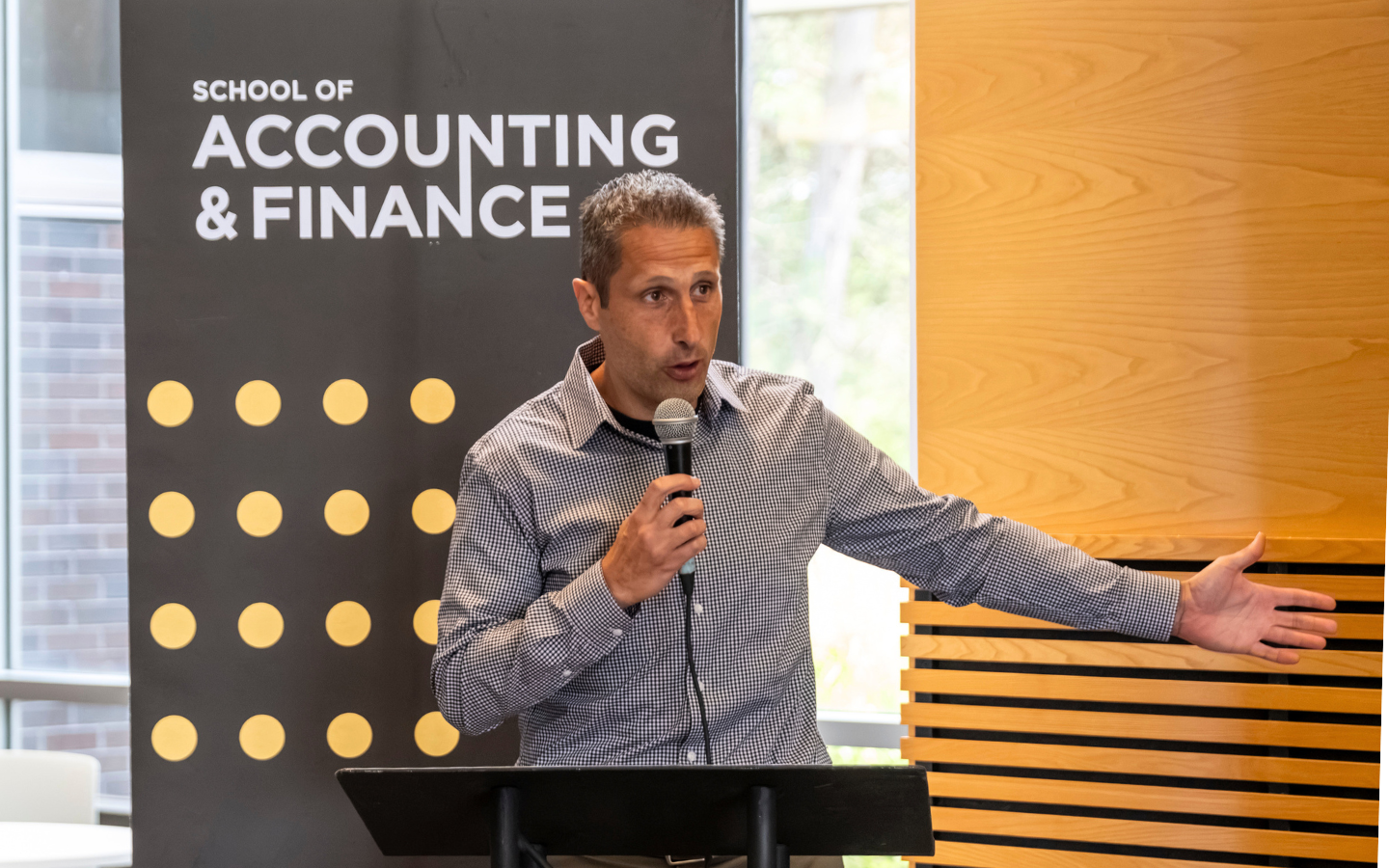 Andrew Bauer speaking at the ceremony