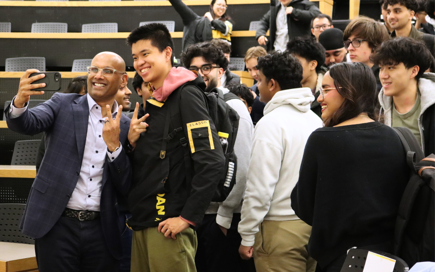 Benjie Thomas taking a selfie with student